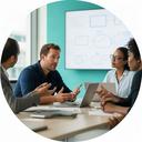 Business transformation lead speaking with a client team around a meeting table